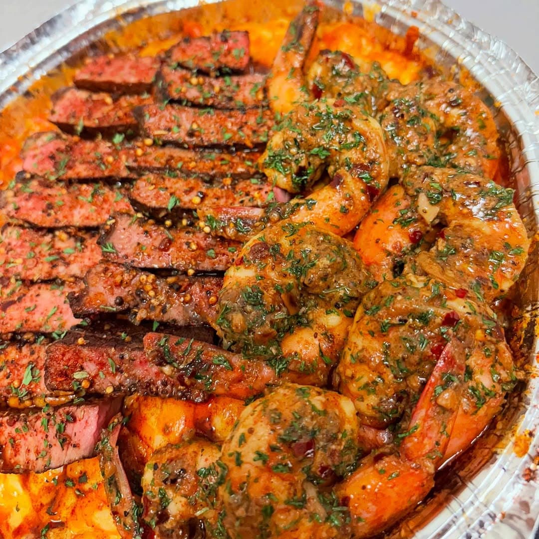 Seasoned sirloin, garlic butter shrimp, and cajun mac